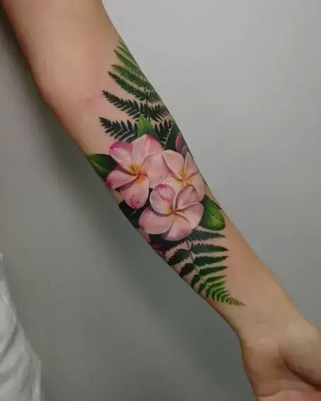 Tattoo of Pink Plumeria Flowers and Green Leaves