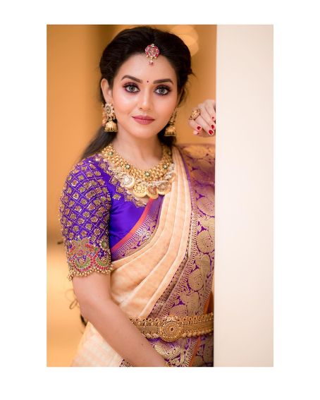 Royal blue Aari work saree blouse cream color saree for brides