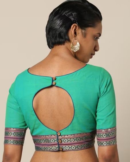 cotton blouse designed with an open-back and wooden buttons
